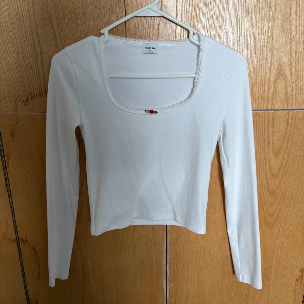 Aritzia White Long Sleeve Top with Flower Accent